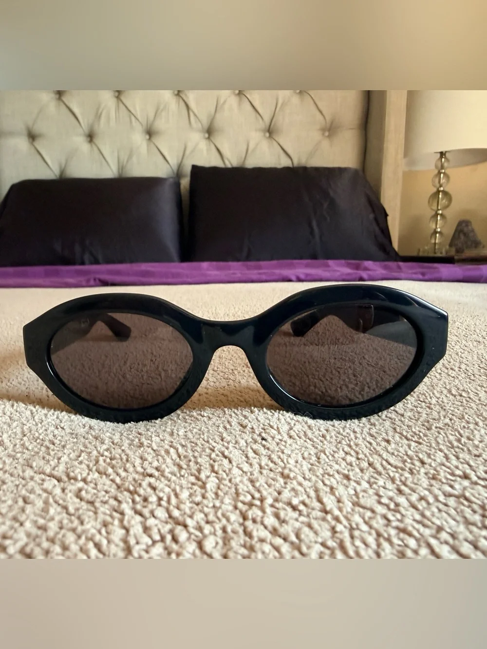 Gucci Black Oval Sunglasses with Gold Logo Accent